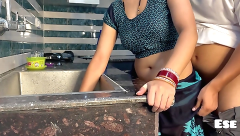 Indian bhabhi gets banged in the kitchen on her back