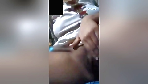 Hairy Indian brunette gets naked and starts rubbing her hairy pussy