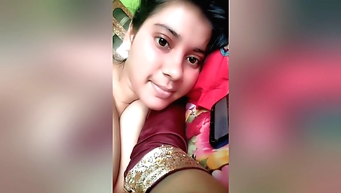 Indian brunette naked in bed and doing masturbation