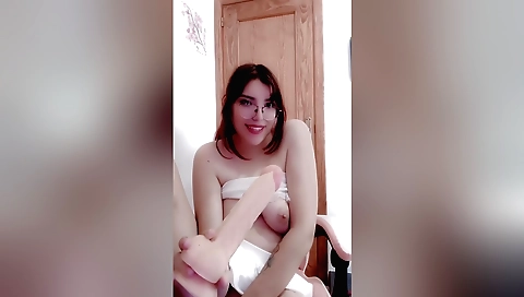 Busty brunette girl with big boobs playing with her tits