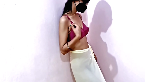 A sexy brunette wife dances in her house with her hands