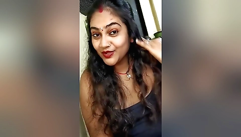 Indian solo female show off her body in a white sweater