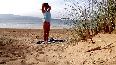 Hot brunette with amazing body is getting off a motorcycle