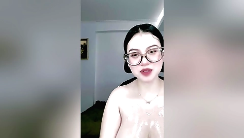 Indian woman exposing herself to oil in the bedroom