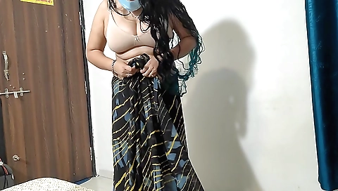 Indian woman with nice body wears a red saari and looks good