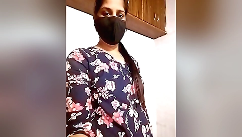 Sexy brunette girl dances with a vibrator on her knees