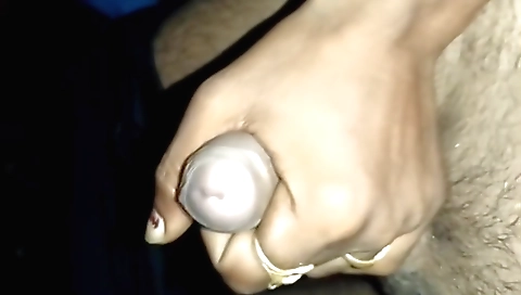 A very tight amateur is getting a handjob done to her ass