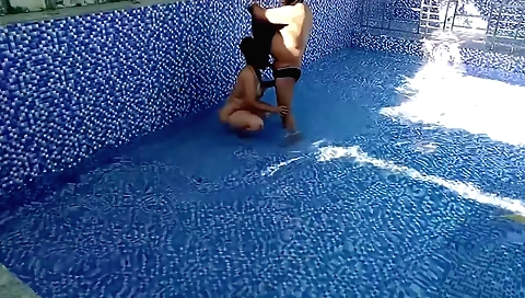 Indian babes in swimming pool have fun with each other
